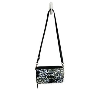 Vera Bradley all in one crossbody in Snow Lotus pattern, retired in 2017.